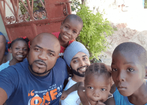 Our local Khalsa Aid man on the ground who is born and bred in Haiti, Marcsan Balan, pictured in the blue and myself in the white T-shirts, at one orphanage we grew to call 'the mountain one'.