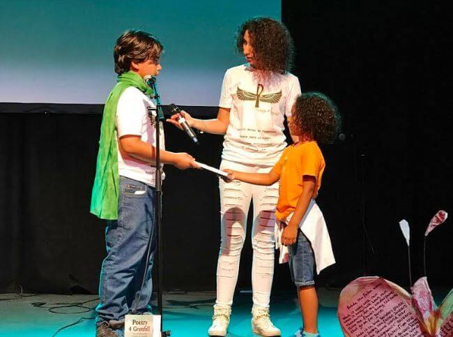 Hesham Rahmaan's Nephew - Receiving the 1st Poetry4Grenfell BOOK offering by Lion'el-Marcel